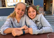 Sisters win prestigious award for their fantastic fundraising efforts for Cancer Research Wales