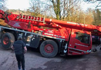 Crane driver's low point as it sinks into a ditch