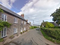 School catchment split on village's main road ended