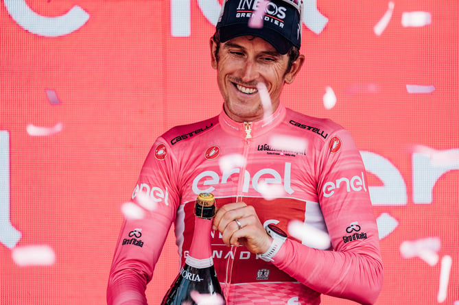 Giro leader Geraint Thomas opens a podium bottle of bubbly on his 37th birthday 