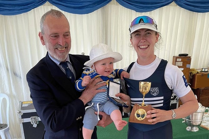 Mathilda Hodgkins-Byrne receives her trophy with son Freddie