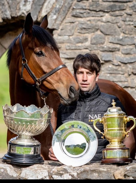 Christian Williams with Kitty's Light and their trophies