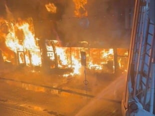 Fire fighters battle to save historic town centre shops in Abergavenny
