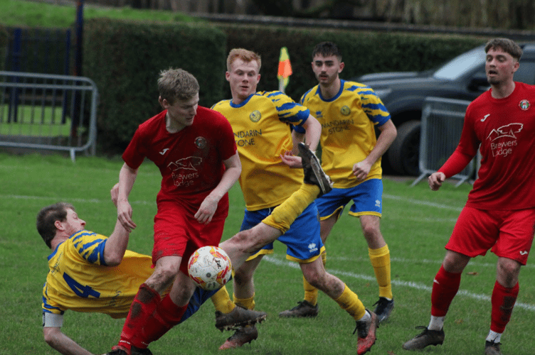 Players battle for the ball in the Monmouth Town v Cefn Forest match