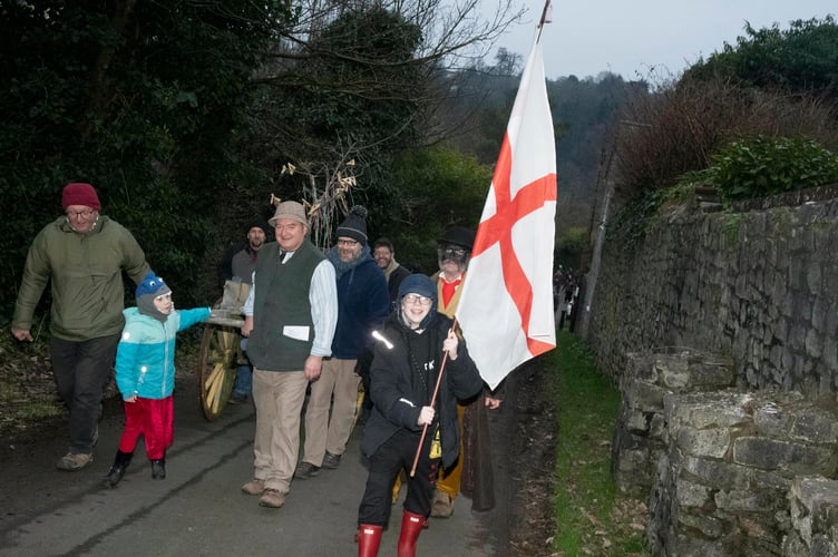 The English contingent at Tutshill led by Asher Rowe carrying the flag of St George.