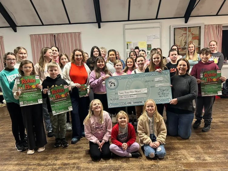 Photo attached of the Robin Hood & the Babes in the Wood chorus donating £200 to Louise Rixon, Community Fundraiser for Gwent Parent Carer Network. Abergavenny Pantomime Company