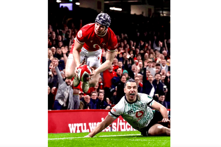 Tom Rogers leaps and scores Wales' second try. Photo: WRU