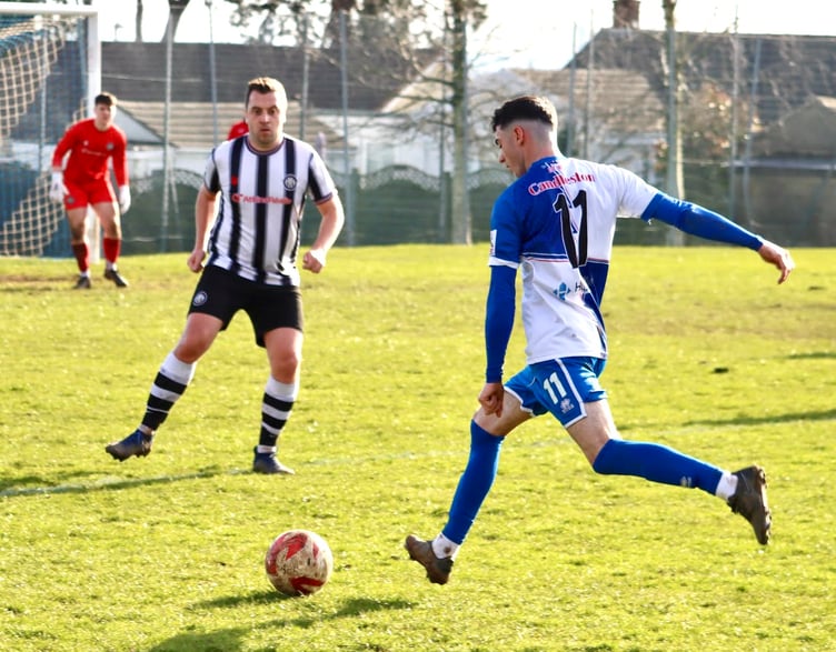 A Chepstow player tries his luck from distance