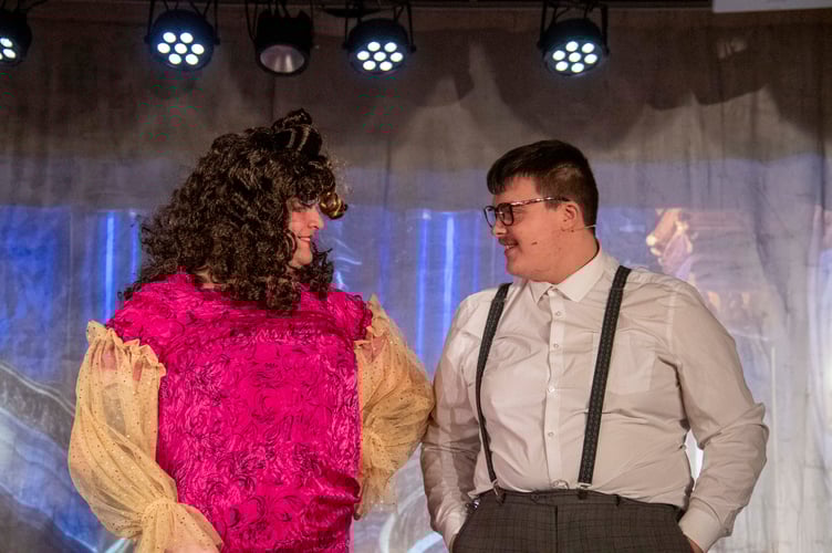 Dame Edna (NickTaylor)  in a final change of costume with Dave (Jake Brice)