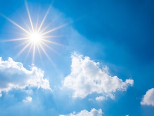 Sunny day with occasional clouds, slight chance of rain
