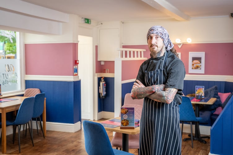 Bar manager Daniel Elliott behind the bar at the Lion Lounge.