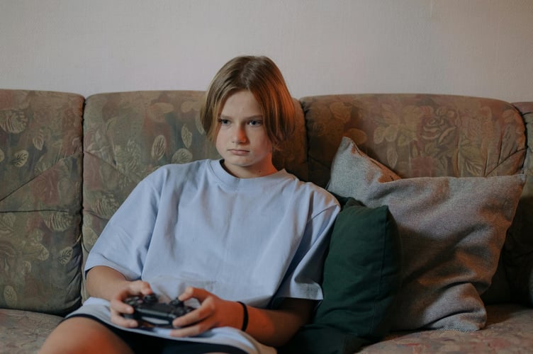 Kid playing video games