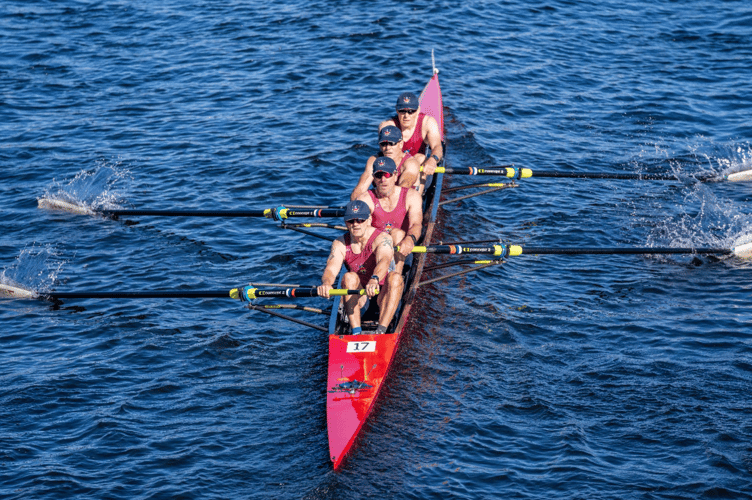The Monmouth RC four shot a bridge on their way to victory in the Head of the Charles