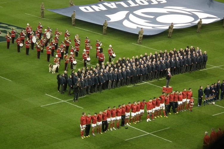 The Monmouth Male Voice Choir help stir the fire of the Wales team with a rousing rendition of the Welsh national anthem