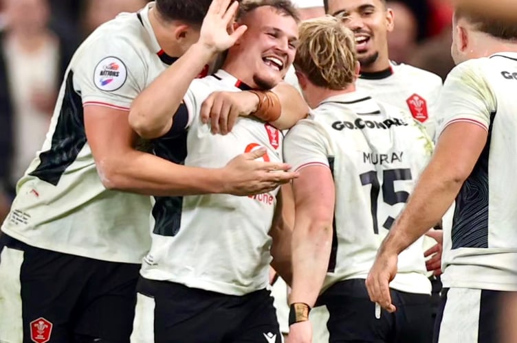 Jarrod Evans is mobbed after his last-gasp winning kick