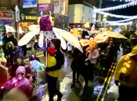 Lantern parade blazes a trail through wind and rain