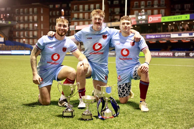Ollie Park (right) celebrates with his Royal Air Force back row colleagues at Cardiff Arms Park