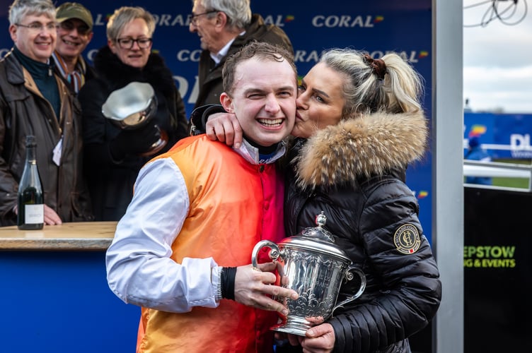 A kiss for winning jockey Sean Bowen from winning trainer Rebecca Curtis