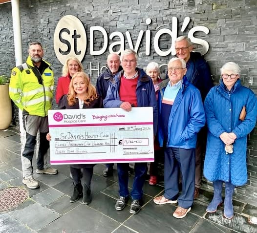 St David's Hospice Care chief executive Emma Saysell holds the cheque with Rotarian Norman Williams. Photo: Nigel Heath, Monmouth Rotary