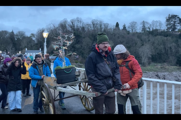 An apple tree is brought across the Wye Bridge.